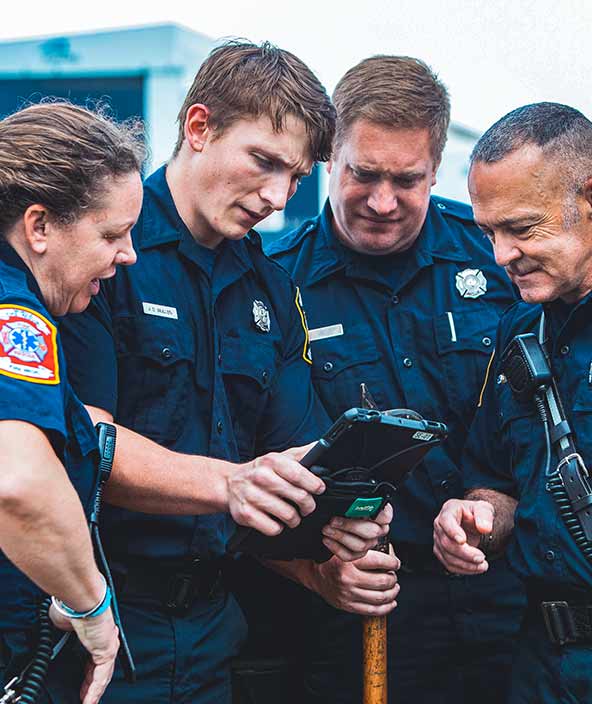 police, fire and EMS agencies looking at incident information and details on a tablet.
